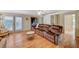 Living room featuring a fireplace, hardwood floors, built-in cabinets and sliding doors at 3141 E Katie Ave, Las Vegas, NV 89121