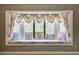 Comfortable window seat with decorative cushions and curtains at 3141 E Katie Ave, Las Vegas, NV 89121