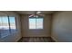 Bedroom featuring plank flooring, a ceiling fan and bright window views at 3151 Soaring Gulls Dr # 2058, Las Vegas, NV 89128