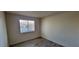 Bedroom with window and blinds and wood-look flooring at 3151 Soaring Gulls Dr # 2058, Las Vegas, NV 89128
