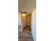 Hallway featuring wood look floors and neutral colored walls leading to bedrooms and living spaces at 3151 Soaring Gulls Dr # 2058, Las Vegas, NV 89128