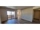 Bright living space featuring plank flooring and sliding glass door to outdoor space at 3151 Soaring Gulls Dr # 2058, Las Vegas, NV 89128