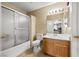 Bathroom featuring single sink vanity, a toilet and a tub/shower combo with sliding glass doors at 3464 Twilight Star Dr, Las Vegas, NV 89117
