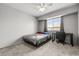 Bedroom showcasing a ceiling fan, window, desk, and neutral walls with carpet flooring at 3464 Twilight Star Dr, Las Vegas, NV 89117