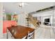 Comfortable dining area next to staircase and kitchen, filled with natural light at 3464 Twilight Star Dr, Las Vegas, NV 89117