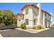Charming stucco home featuring a red tile roof, arched windows, and desert landscaping at 3464 Twilight Star Dr, Las Vegas, NV 89117