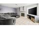 Comfortable living room with a fireplace, plush seating, and neutral colors at 3464 Twilight Star Dr, Las Vegas, NV 89117