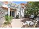 Inviting patio featuring a pergola, flowering trees, and comfortable seating, perfect for outdoor relaxation at 3464 Twilight Star Dr, Las Vegas, NV 89117