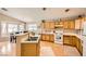 Well-lit kitchen with classic cabinetry and laminate countertops at 3539 Barrel Bronco Ct, North Las Vegas, NV 89032