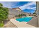Private backyard pool with a soothing water feature provides relaxation and enjoyment at 3539 Barrel Bronco Ct, North Las Vegas, NV 89032