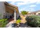Backyard with covered patio, grill, desert landscaping, and block fence at 3646 Billman Ave, Las Vegas, NV 89121