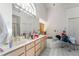 Bathroom with double vanity, large mirror, and soaking tub at 3646 Billman Ave, Las Vegas, NV 89121