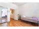 Bedroom with hardwood floors, a large mirror, and doorway to another room at 3646 Billman Ave, Las Vegas, NV 89121