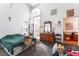 Primary bedroom featuring vaulted ceiling, mirror and personal items on dresser at 3646 Billman Ave, Las Vegas, NV 89121