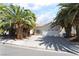Charming single story home with a two car garage, desert landscaping and mature palm trees at 3646 Billman Ave, Las Vegas, NV 89121