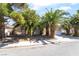 Charming single story home with a two car garage, desert landscaping and mature palm trees at 3646 Billman Ave, Las Vegas, NV 89121