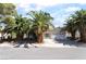 Charming single story home with a two car garage, desert landscaping and mature palm trees at 3646 Billman Ave, Las Vegas, NV 89121