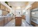 Bright kitchen with tile floors, an island, and plenty of countertop space at 3646 Billman Ave, Las Vegas, NV 89121