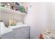 Laundry room with front loading machines, and white wire shelving above at 3646 Billman Ave, Las Vegas, NV 89121