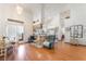 Open living area featuring laminate floors, kitchen view, and dining area at 3646 Billman Ave, Las Vegas, NV 89121