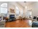 Bright living room with fireplace, large windows, and laminate flooring at 3646 Billman Ave, Las Vegas, NV 89121