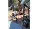 The backyard patio is perfect for relaxing with a brick floor, outdoor furniture and string lights at 3854 Chutney St, Las Vegas, NV 89121