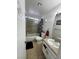 Bathroom featuring shower and tub combo, granite countertop, and updated fixtures at 3854 Chutney St, Las Vegas, NV 89121