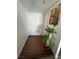 Entryway with hardwood floors, coat closet, and artwork for an inviting welcome at 3854 Chutney St, Las Vegas, NV 89121