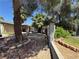 Charming front yard with mature trees, gravel landscaping, and a welcoming walkway at 3854 Chutney St, Las Vegas, NV 89121