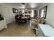 Living Room with dinette table and chairs, view of the fireplace, and a large mirror at 3854 Chutney St, Las Vegas, NV 89121