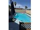 A private outdoor pool in a fenced backyard offers a cool retreat on a sunny day at 3854 Chutney St, Las Vegas, NV 89121