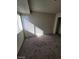 Bedroom with a window that brings in natural light and neutral carpet and walls at 4363 Spencer St # 8, Las Vegas, NV 89119