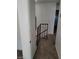 Hallway with carpet floors and neutral walls leads to the upper level and other areas of the home at 4363 Spencer St # 8, Las Vegas, NV 89119
