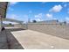 Large backyard with a concrete patio and block wall fencing at 460 Crestway Rd, Henderson, NV 89015