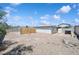 View of backyard and desert landscape, with block wall and wood slat fences at 460 Crestway Rd, Henderson, NV 89015