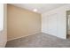 Bedroom with neutral walls, carpet, and closet with sliding doors at 460 Crestway Rd, Henderson, NV 89015