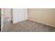 A simply decorated bedroom featuring carpeted flooring and a closet with sliding doors at 460 Crestway Rd, Henderson, NV 89015