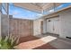 Private entryway with a secure gate and double doors leading to the home's interior at 460 Crestway Rd, Henderson, NV 89015