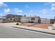 Cozy single-level home featuring a convenient covered parking space and xeriscaped front yard at 460 Crestway Rd, Henderson, NV 89015