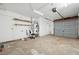 Spacious garage with overhead lighting and shelving providing ample storage at 460 Crestway Rd, Henderson, NV 89015