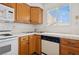 Kitchen details include sink, dishwasher, window with a view, wood cabinets, and tiled counters at 460 Crestway Rd, Henderson, NV 89015