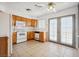 Kitchen offers wood cabinets, modern appliances, and access to the outdoors through glass panel doors at 460 Crestway Rd, Henderson, NV 89015