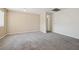 Bright living room with plush carpeting and neutral walls, ready for personalization at 460 Crestway Rd, Henderson, NV 89015