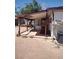 View of a back porch area with an open frame and table with cloth covering at 4727 Conrad St, Las Vegas, NV 89121