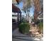 Cozy backyard with covered porch and desert landscaping with mature tree at 4727 Conrad St, Las Vegas, NV 89121