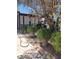 Backyard with desert landscaping, mature tree and covered porch at 4727 Conrad St, Las Vegas, NV 89121
