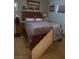 Comfortable bedroom with a well-crafted wooden bed frame and cozy furnishings at 4727 Conrad St, Las Vegas, NV 89121