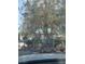 Single story home with desert landscaping including a variety of large potted plants at 4727 Conrad St, Las Vegas, NV 89121