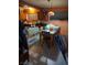 Functional kitchen with wooden cabinets and a dining area, offering plenty of space at 4727 Conrad St, Las Vegas, NV 89121