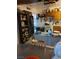 Functional kitchen with ample storage, black refrigerator, and adjacent dining space at 4727 Conrad St, Las Vegas, NV 89121